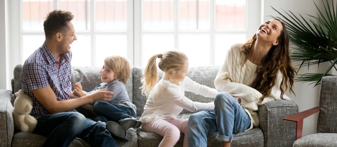 Two parents with their kids