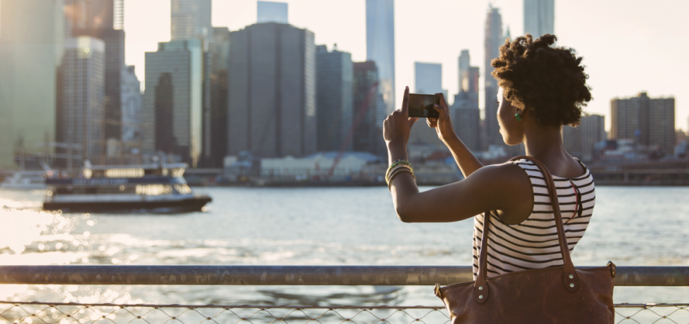 Woman taking pictures of Manhattan