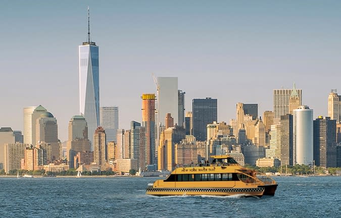 New York Water Taxi sailing in front of downtown Manhattan