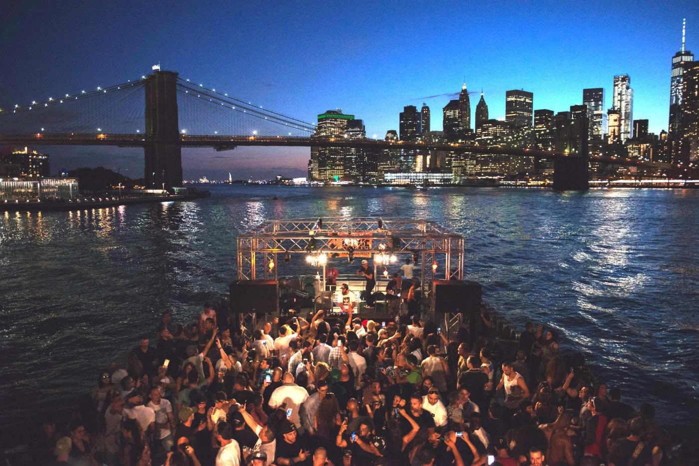 Guests enjoying live music on a boat in the evening