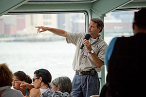 Tour guide narrating during cruise