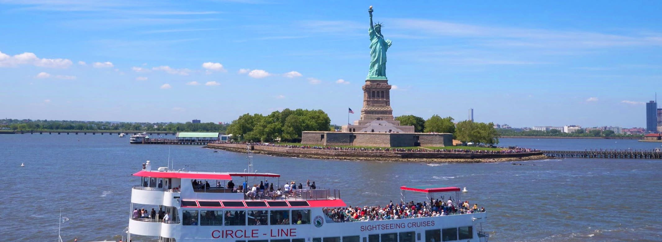 Bronx class in front of Statue of Liberty