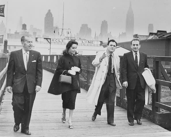 RT COHN, Elizabeth Taylor, Michael Todd and a fourth unidentified man on the gangway, October 18, 1957