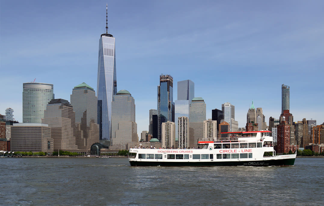 Circle Line cruising in front of Downtown Manhattan and One World Trade