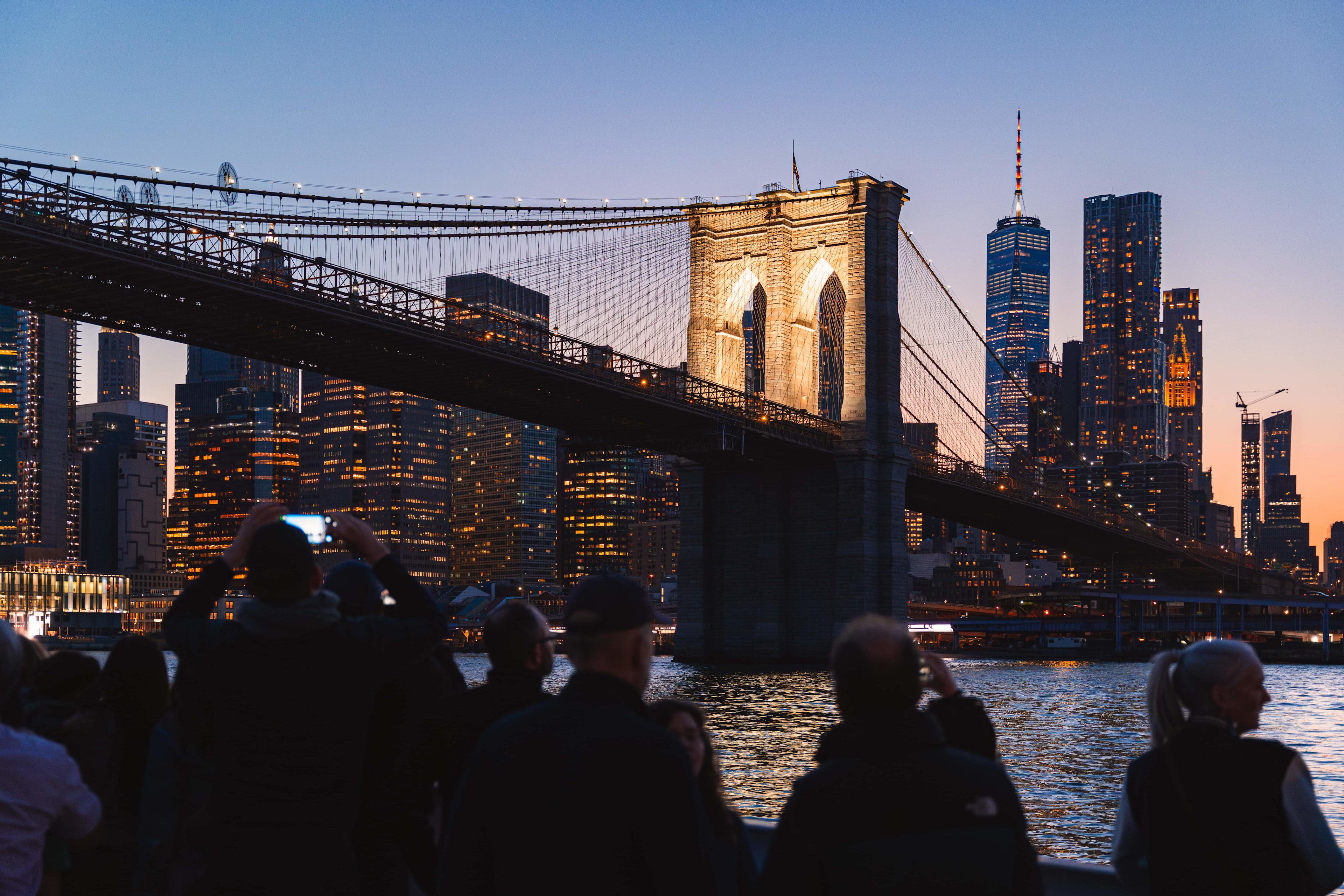 Circle Line boat and New York City skyline at night