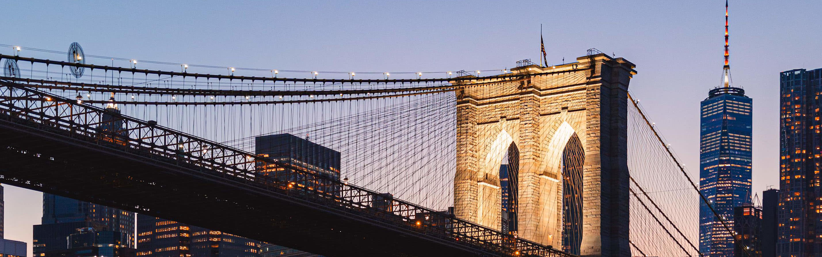 Brooklyn bridge and freedom tower at night