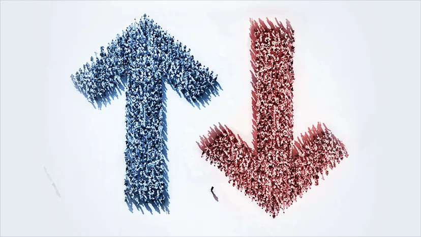A large blue upward-pointing arrow on the left and a large red downward-pointing arrow on the right are formed by hundreds of small human figures standing together.