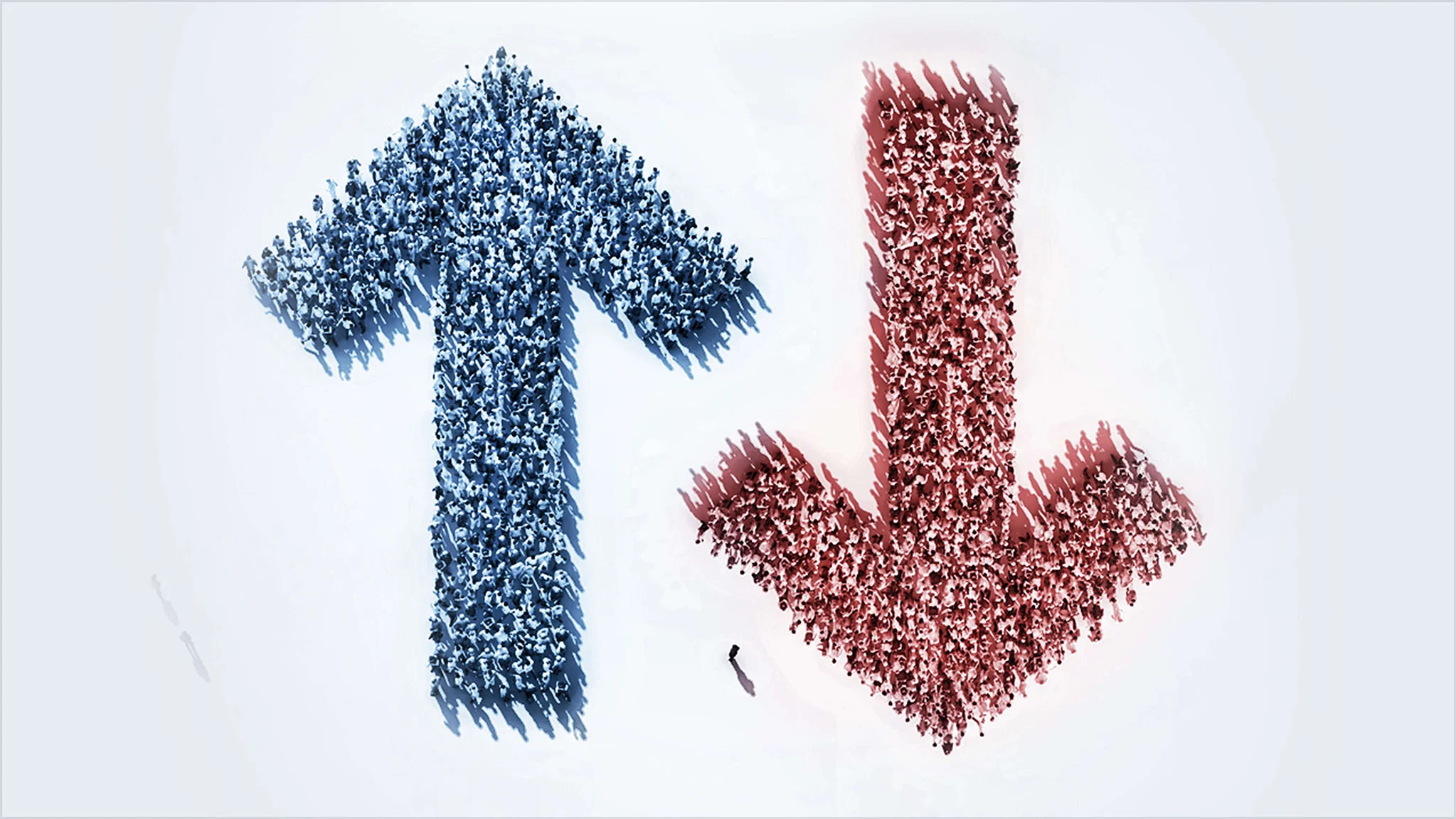 A large blue upward-pointing arrow on the left and a large red downward-pointing arrow on the right are formed by hundreds of small human figures standing together.