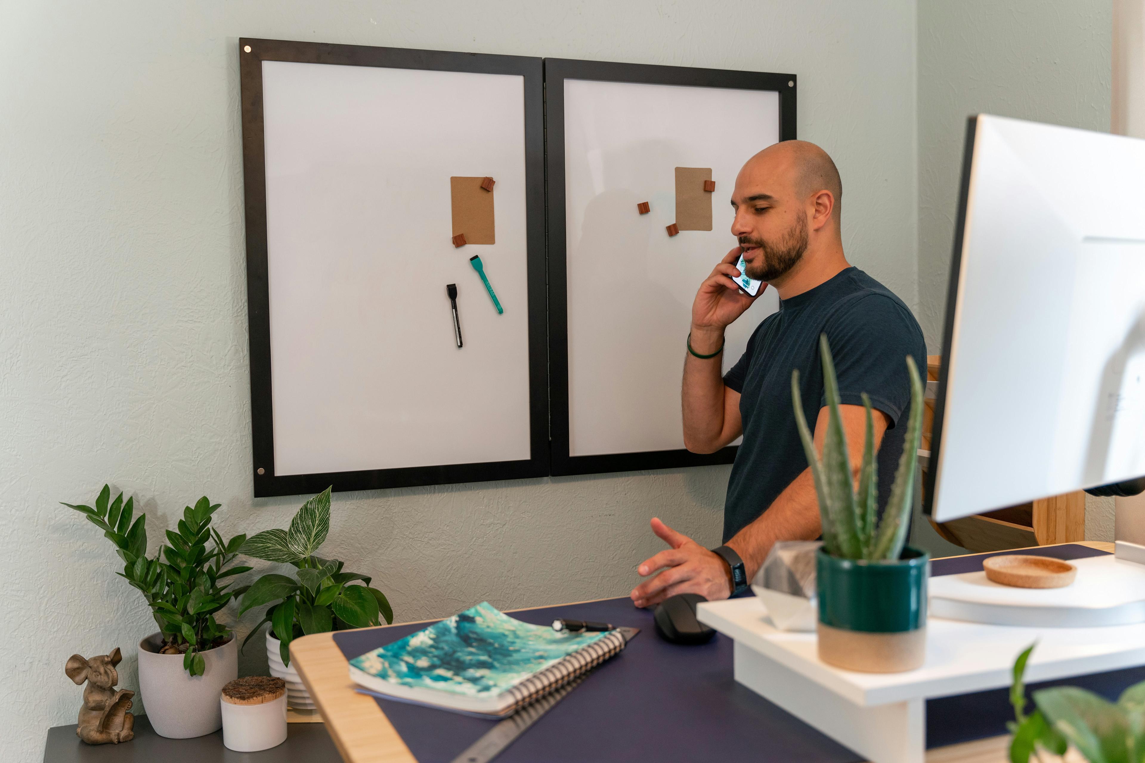 Cover Image for Professional taking a phone call in a modern workspace