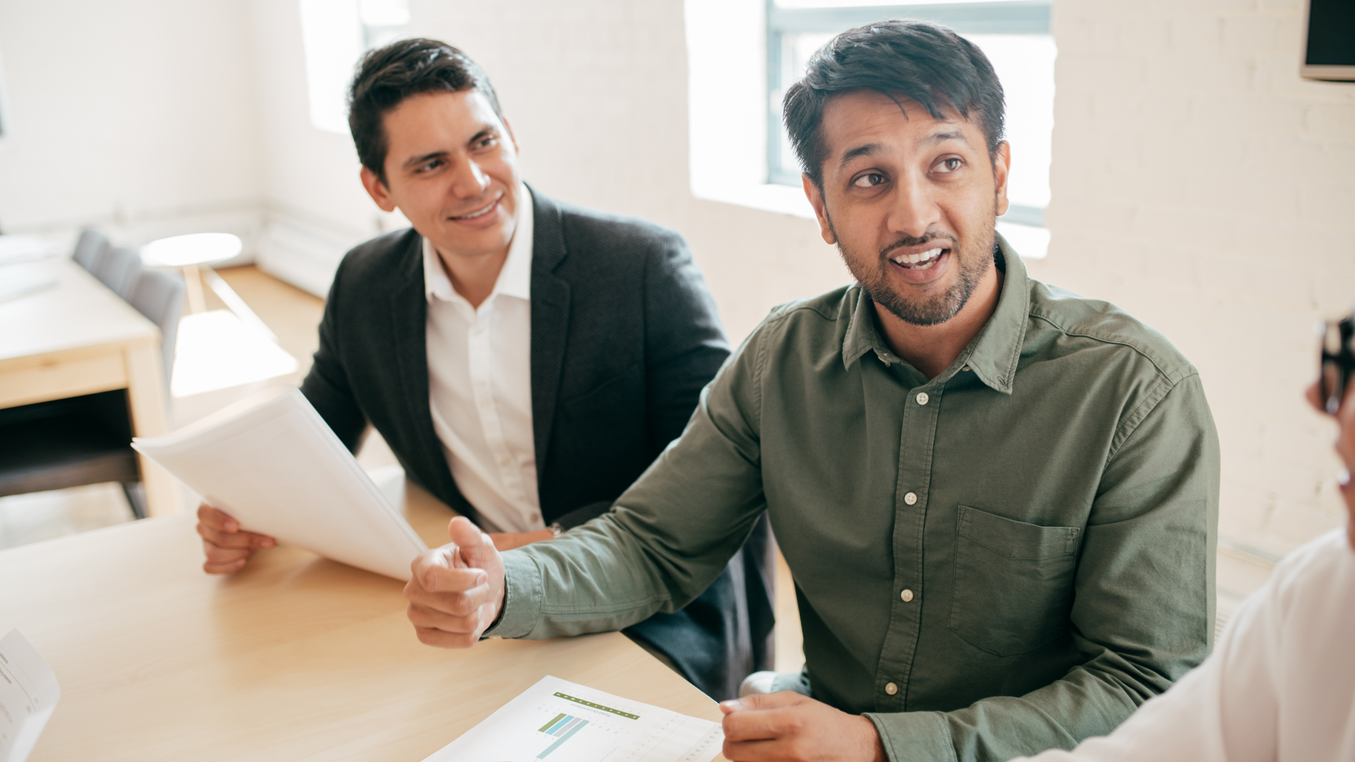 2 professional guys at table