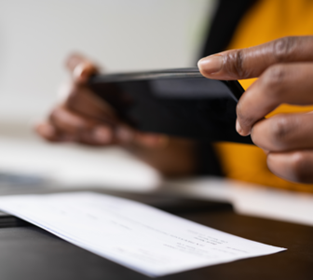 person depositing a check using a mobile phone
