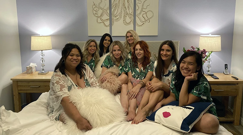A group of Instagram influencers sitting on a white King Standard Bed