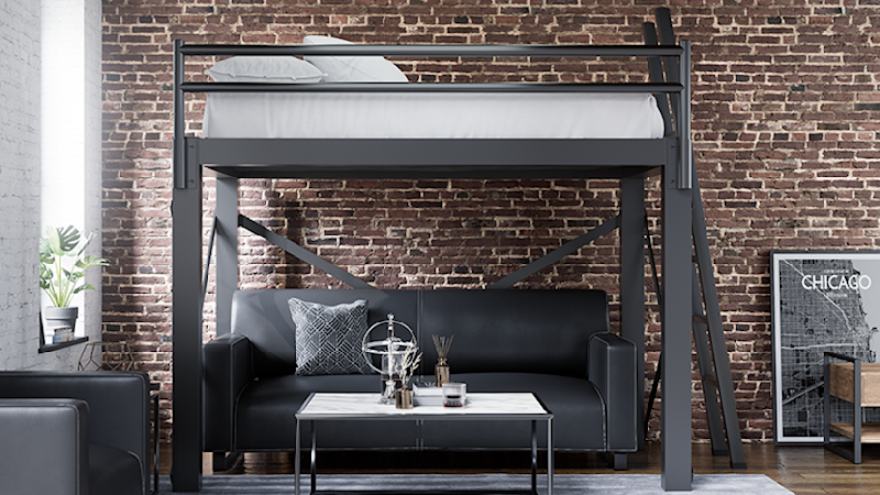 Charcoal Queen Adult Loft Bed in an upscale urban apartment with exposed brick walls and a nice black leather loveseat under the bed seen directly from the right-hand side of the bed away from the wall.
