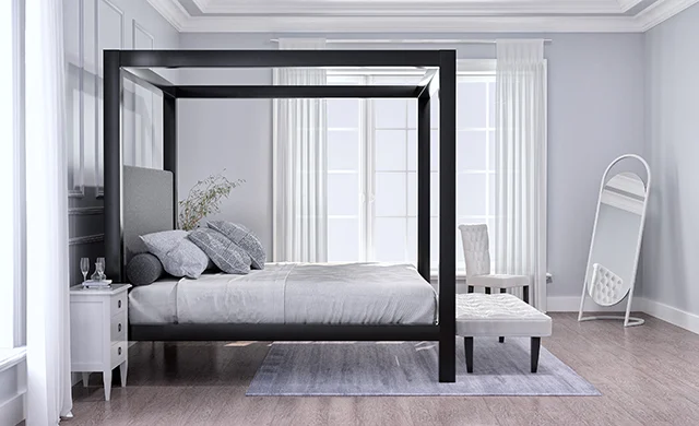A black Wyoming King size four poster Canopy Bed in a minimalist luxury master bedroom decorated mostly in white and dark colors seen directly from the left side at a slight distance.