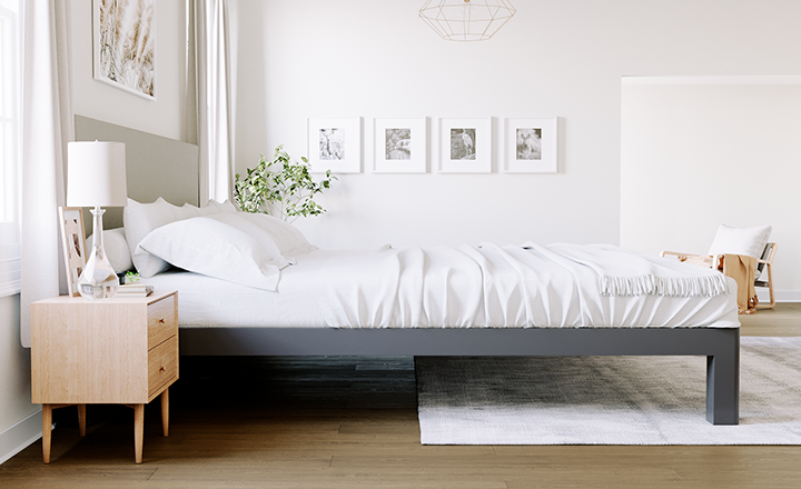 Charcoal Alaskan King Bed with a light gray headboard in a nice, neutral master bedroom seen directly from the right-hand side of the bed frame.