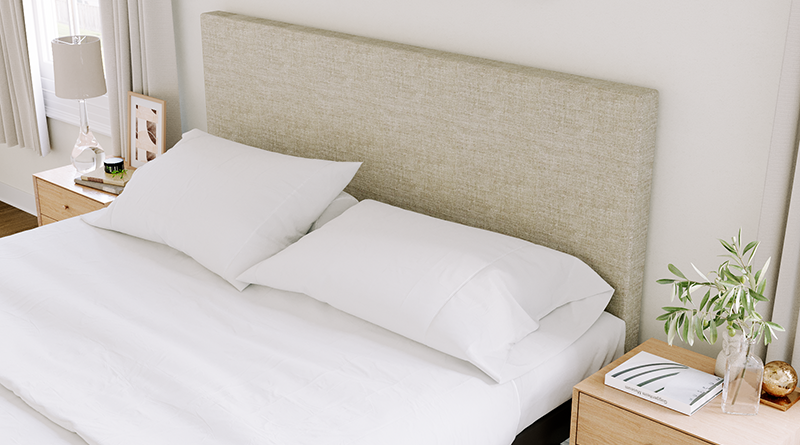 Charcoal Texas King Platform Bed with an oatmeal headboard in a neutral upscale master bedroom seen close up on the headboard from the left-hand side of the bed.