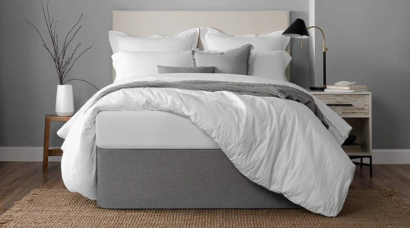A queen size platform bed with a graphite colored Circa Bed Wrap around the bottom of it.