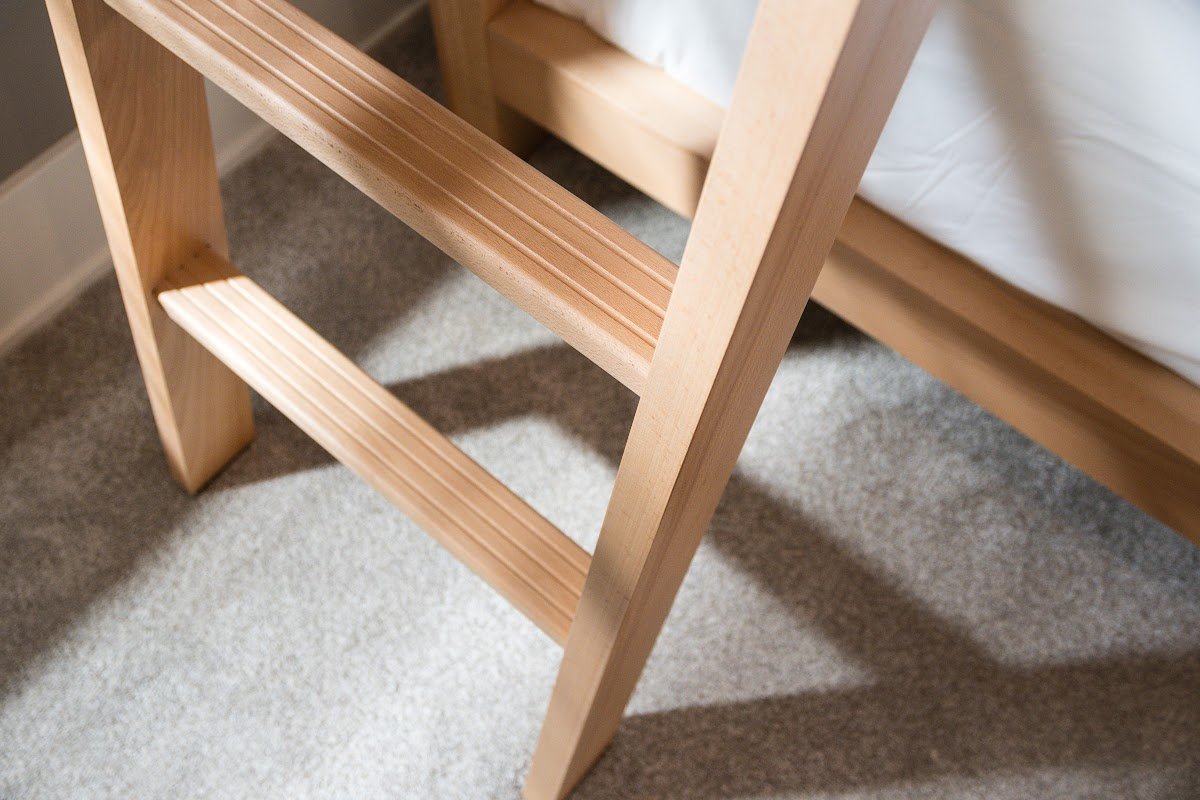Close-up of mortise-and-tenon joinery on a solid beech bunk bed