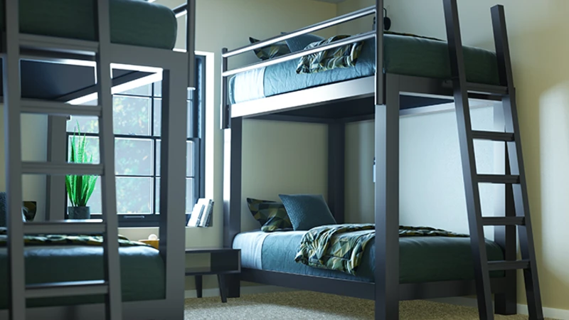 Two Charcoal Adult Bunk Beds in a sparsely decorated guest room side-by-side seen from a close angle at the foot of the left-hand bed facing the lower left-hand corner of the right-side bed.