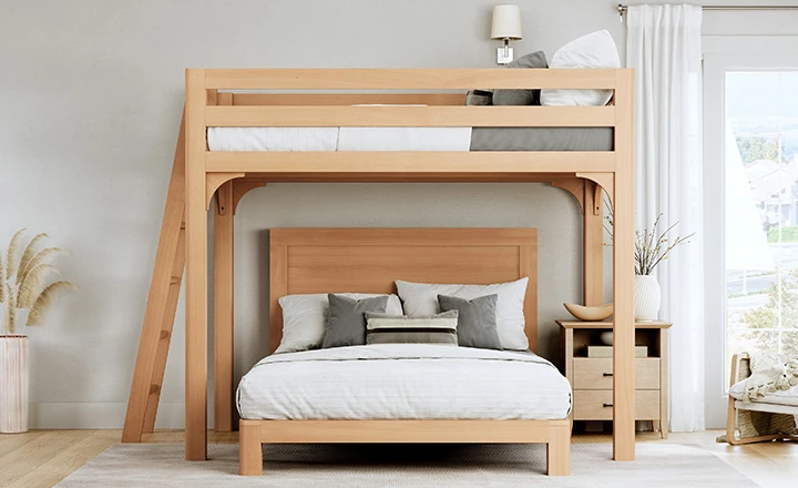 Light-colored Queen Over Queen size Wood L-Shaped Bunk Bed for Adults in a nice, upscale guest room seen directly from the foot of the bottom bunk.