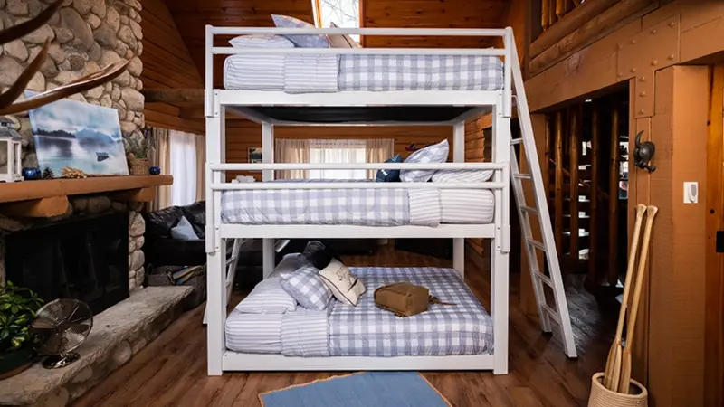 White Queen size Triple Bunk Bed adults in a high end cabin seen directly from the left-hand side of the bed.