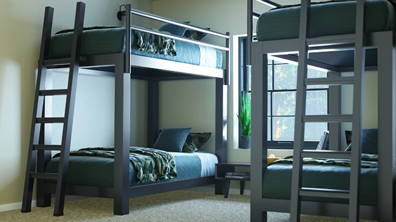 Two Charcoal Adult Bunk Beds in a sparsely decorated guest room side-by-side seen from a close angle at the foot of the right-hand bed facing the lower right-hand corner of the left-side bed.