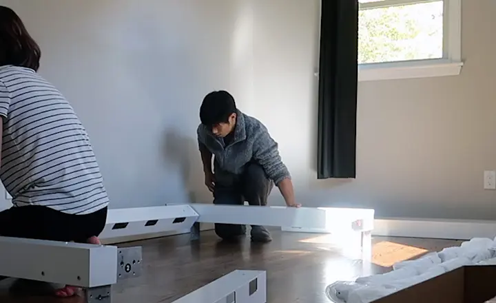 Heather from US Japan Fam and her husband construct a white Twin Over Twin Adult Bunk Bed