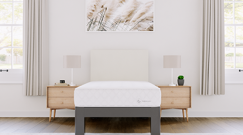 Twin size version of the BigBeds.com Luxe Slumber Hybrid mattress on a charcoal Twin Platform Bed with an Ivory headboard seen directly from the foot of the bed.
