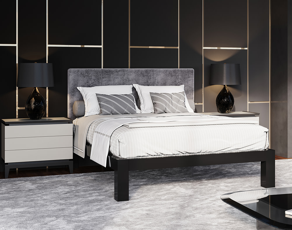 A black queen size metal platform bed with a light gray headboard and white bedding with gray accents in a modern upscale high rise apartment with dark walls. Seen from the lower right hand corner.