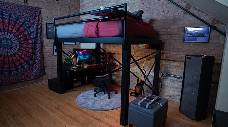 A black Queen Adult Loft Bed in a loft apartment