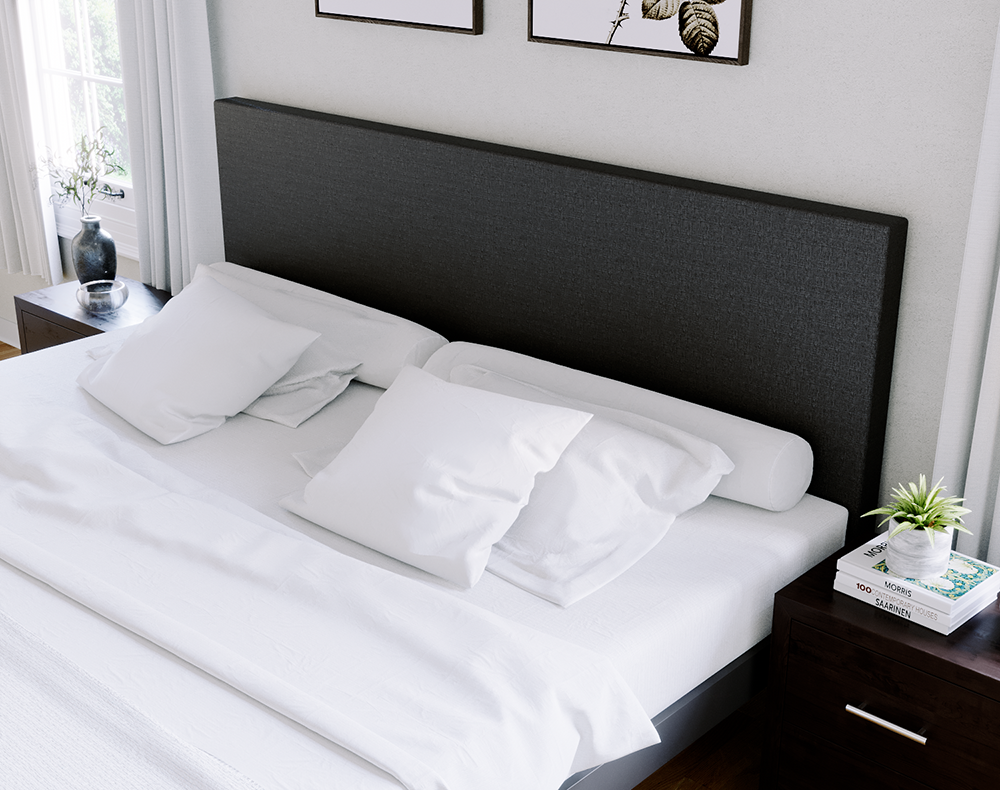 A charcoal Alberta King size metal Platform Bed with charcoal headboard fabric with all-white pillows and bedding seen from the right-hand side of the bed close up on the headboard.