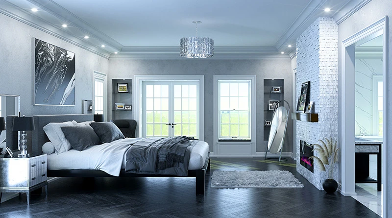 A black Alaskan King metal bed frame with a dark gray headboard in an opulent, luxury master bedroom decorated mostly in gray and black tones. Seen from the left-hand side from a slight distance.