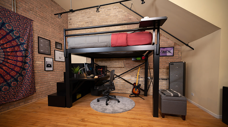 A black Queen Adult Loft Bed with a desk and stairs in an urban loft apartment