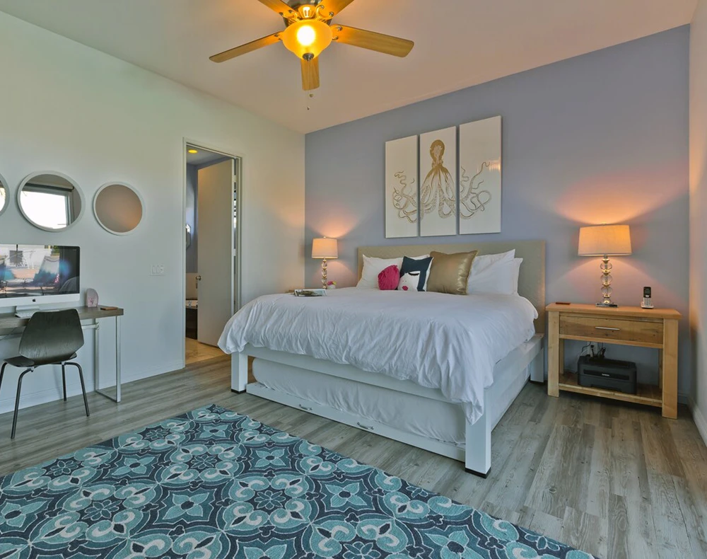 White King size metal Platform Bed with a matching trundle in the bedroom of a beautiful vacation rental in California.