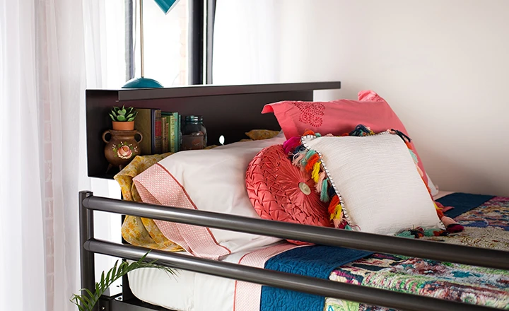 Charcoal Adult Bunk Bed close up on top bunk guard rail and bookshelf headboard.