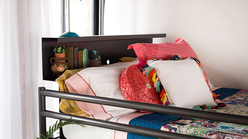 Charcoal Adult Bunk Bed close up on top bunk guard rail and bookshelf headboard.