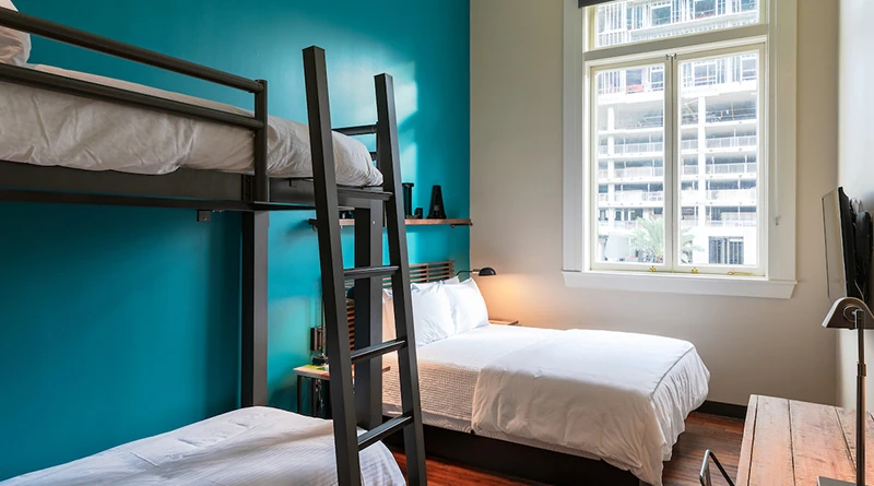 A private room in the Hostelling International USA hostel that features a charcoal Twin XL Over Twin XL Adult Bunk Bed