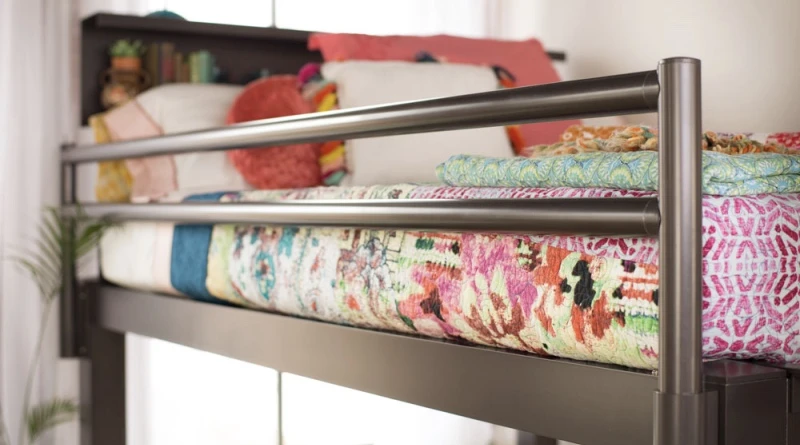 A close up shot of the side rail on the top bunk of a charcoal Adult Bunk Bed.