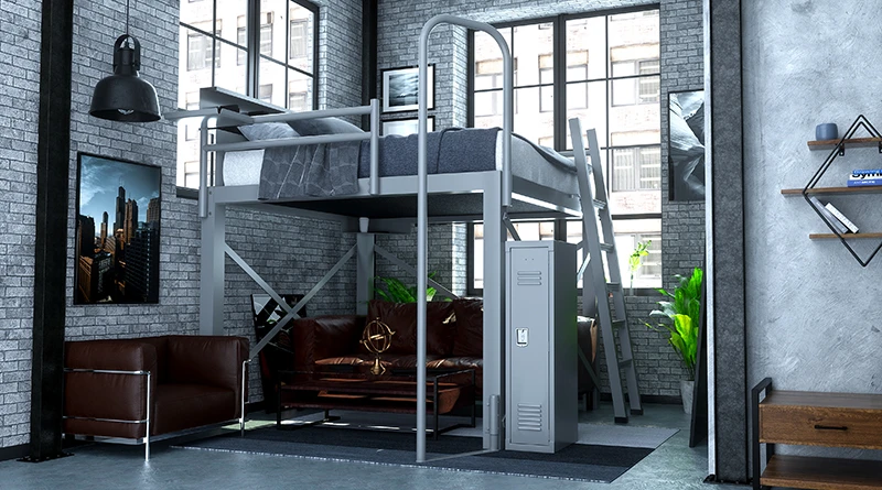 A light gray King Size Loft Bed for adults in a brick-exposed studio apartment with a matching locker and fire pole accessory and a brown leather couch beneath the loft bed. Seen from right-hand corner.