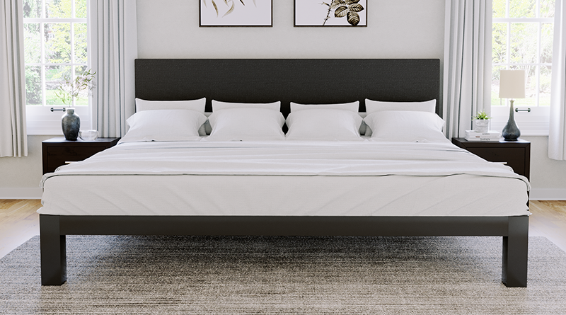 Charcoal Alaskan King Platform Bed with a charcoal headboard in a neutral upscale master bedroom seen directly from the foot of the bed.