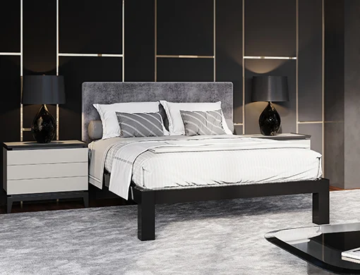 A black queen size metal Platform Bed in a luxury high rise apartment seen close up from the lower right hand corner.