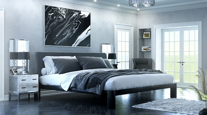 Black Alaskan King size metal Platform Bed with a dark gray headboard in an opulent, luxury master bedroom decorated mostly in black and grays. Seen from the lower left-hand corner.