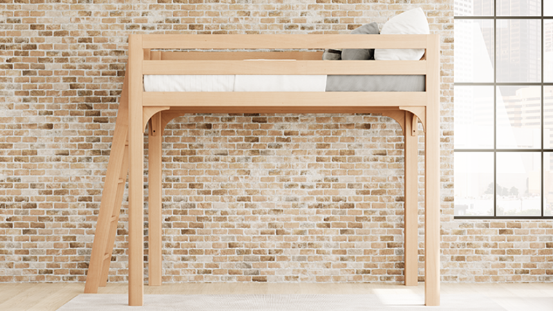 Light colored queen size Wood Loft Bed for Adults in an urban loft-style apartment with exposed brick walls, seen from the left-hand side of the bed at a slight distance.