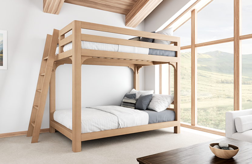 Wood Bunk Bed for Adults in a bright, open bedroom in an upscale cabin with a big window behind it seen from the left-hand side of the bed at a slight angle toward the foot of the bed.