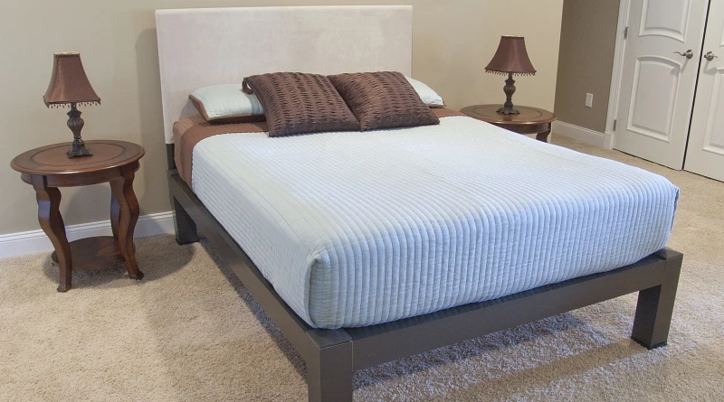 A charcoal Queen Size Standard Bed in a guest room