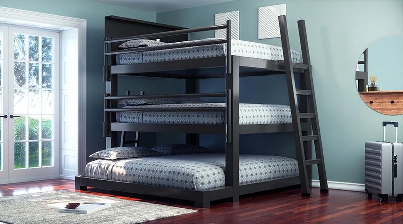 A charcoal Queen Over Queen Over King Triple Bunk Bed for adults in a sparsely decorated guest bedroom seen from the lower right-hand corner.