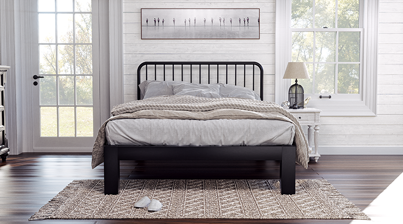 A black Full Platform Bed with a Farmhouse style headboard in a rustic and charming country house bedroom. Seen directly from the foot of the bed.
