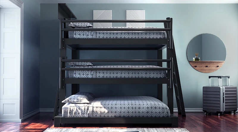 A charcoal Queen Over Queen Over King Triple Bunk Bed for adults in a sparsely decorated guest bedroom seen directly from the side.