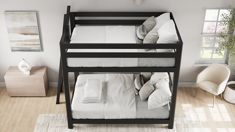 Charcoal queen over queen size Signature Bunk Bed for Adults in a nice, airy, upscale guest room. Has white and light gray bedding on it. Seen from the top of the bed.