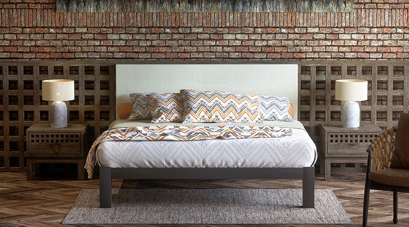  A charcoal colored Wyoming King size metal Platform Bed with a cream headboard in an upscale Western-themed hotel room. Seen here from directly at the foot of the bed.